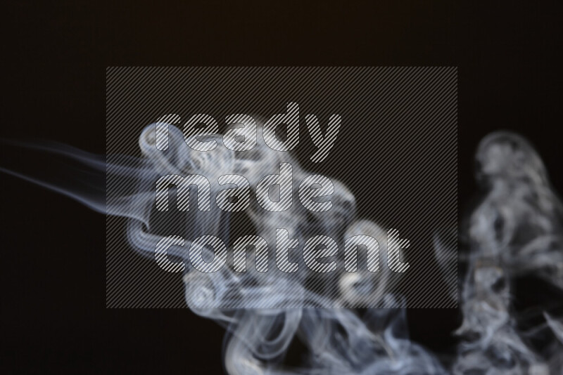 Motion of wavy smoke isolated on dark background