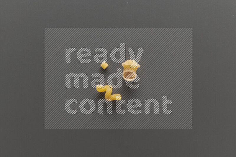Different pasta types on grey background