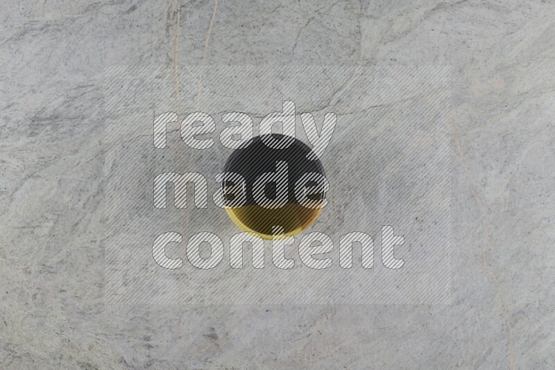 A multicolored pottery Bowl on grey marble background