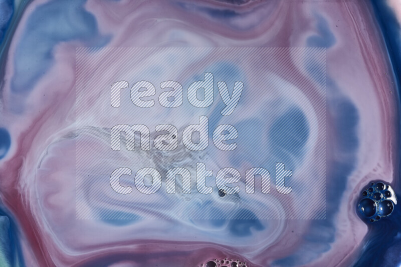 A close-up of abstract swirling patterns in blue, red and white