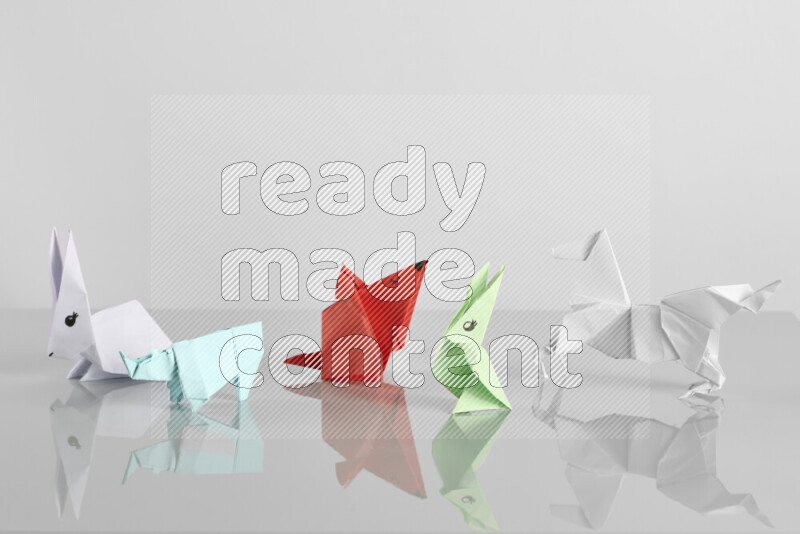 Origami animals on grey background