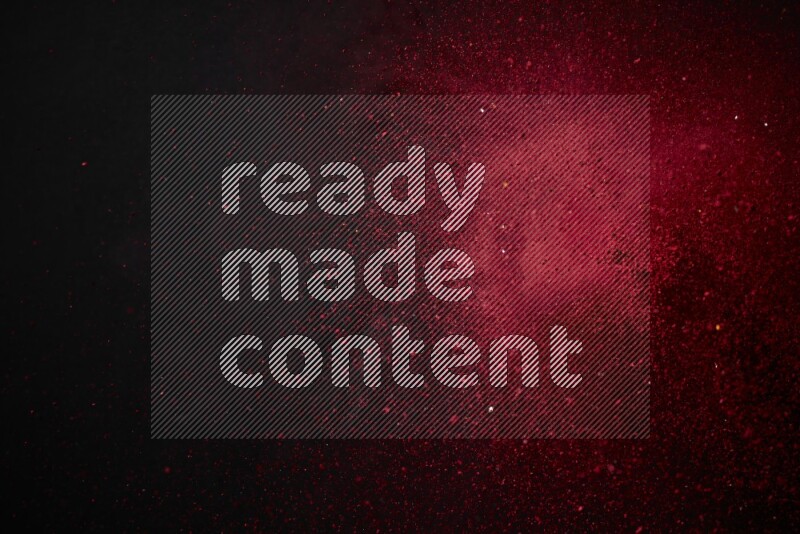 Red powder explosion on black background