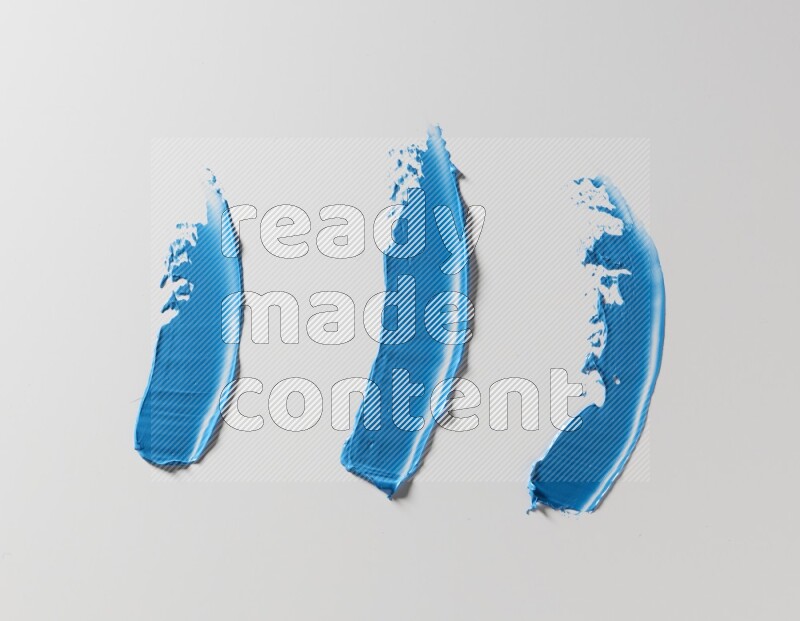 Blue painting knife strokes on white background