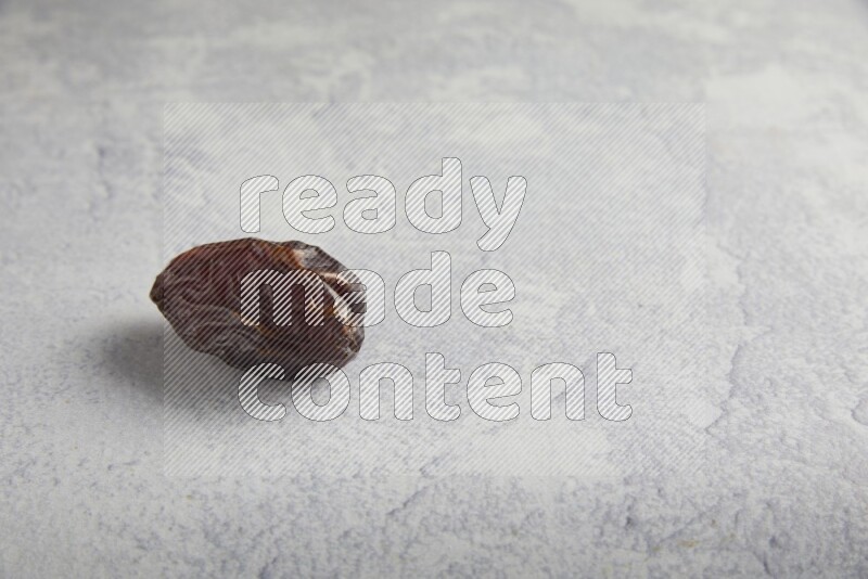 one madjoul date on a light grey background