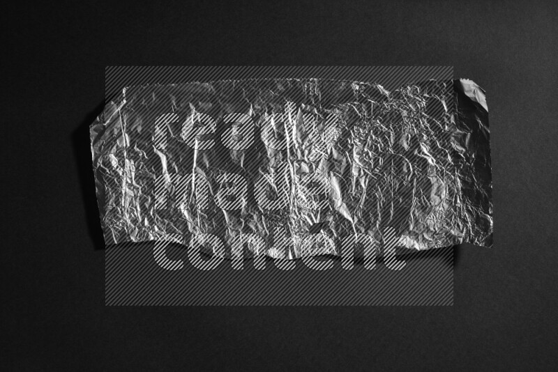 Aluminium foil on black background