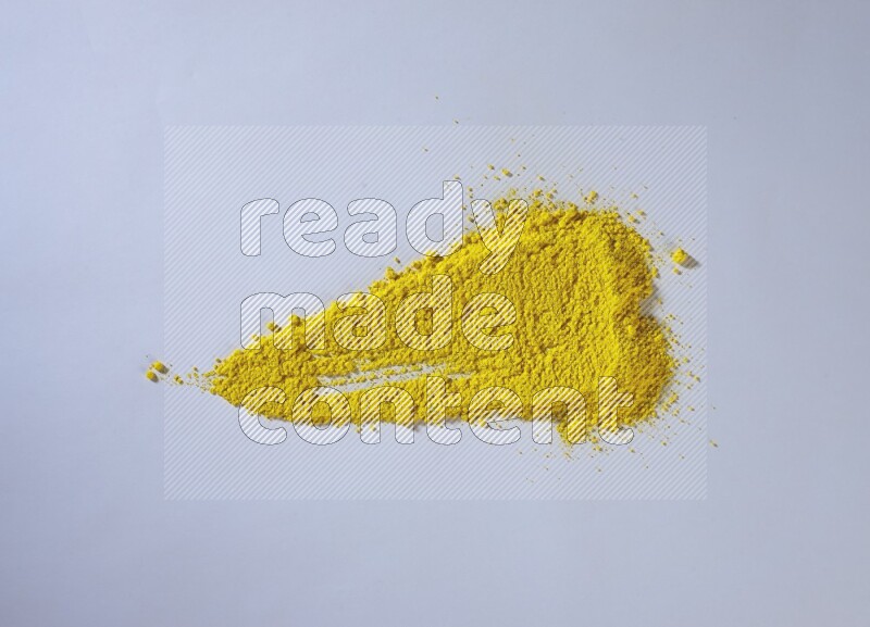 Yellow powder smears on white background