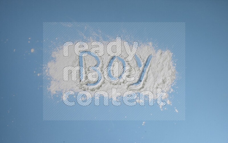 A word written with white powder on blue background