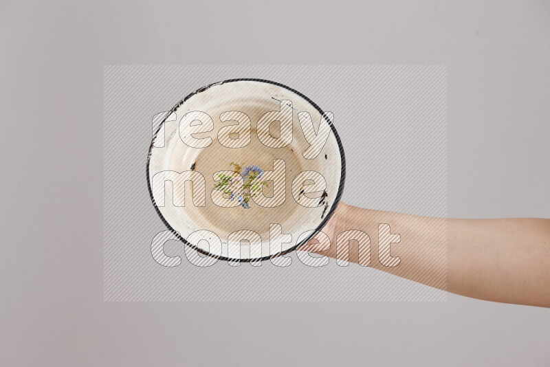 Woman hands holding different metal essentials in different positions