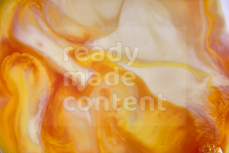 A close-up of abstract swirling patterns in orange, red and white