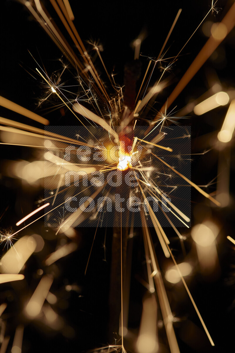 A close-up image of sparkler candle isolated on black background