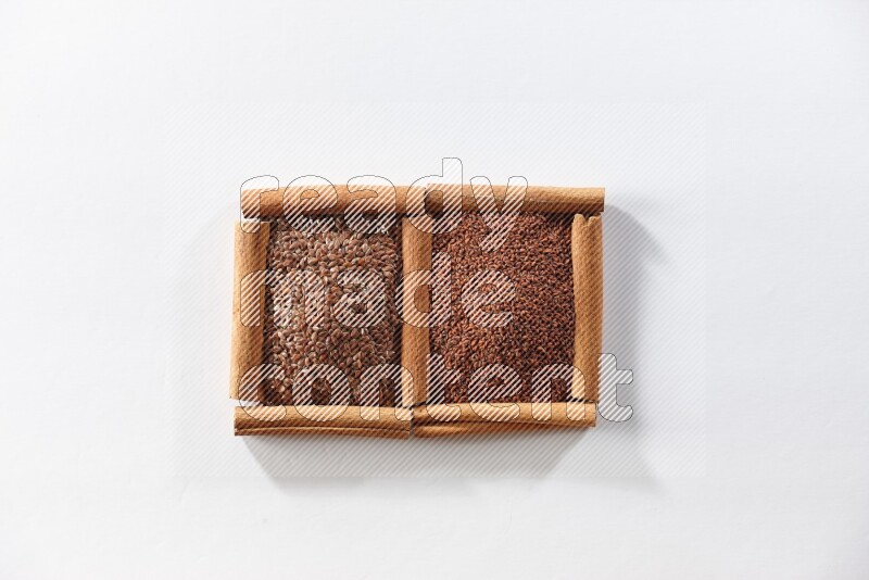 2 squares of cinnamon sticks full of flaxseeds and garden cress on white flooring