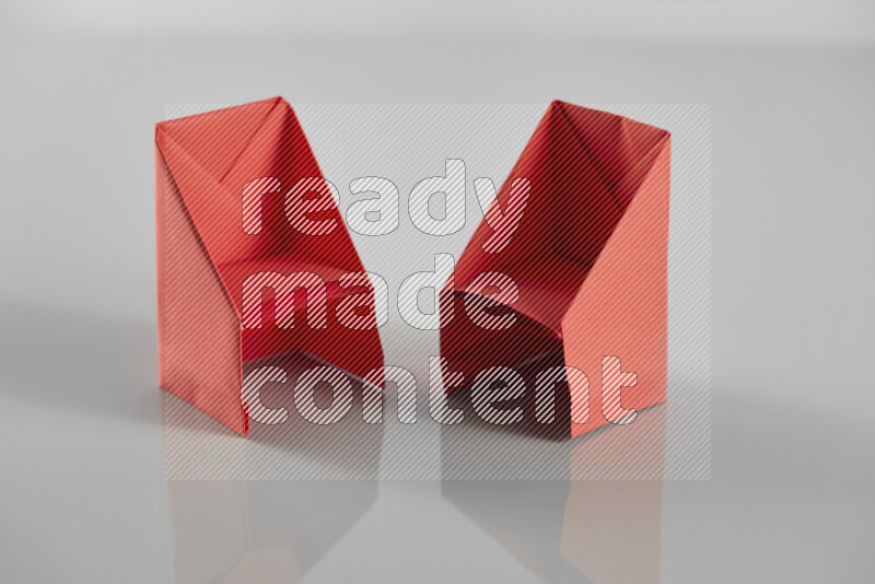 Origami dinning room on grey background