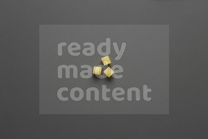 Small rings pasta on grey background