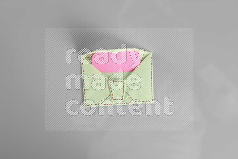 Origami envelope on grey background