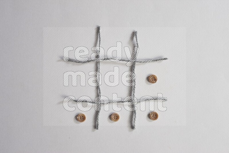 Brown buttons placed on grey background