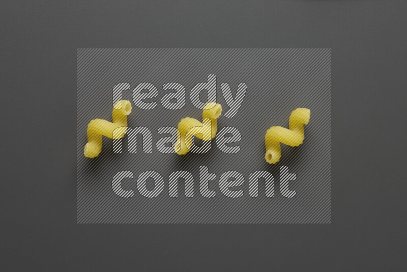 Twist pasta on grey background