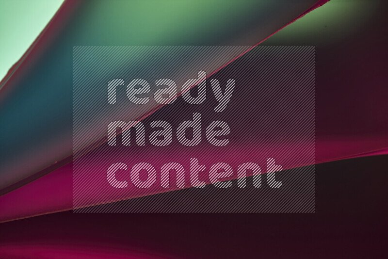 فن تجريدي يعرض منحنيات مع تدرجات الألوان الدافئة والباردة مكونه بضوء ملون