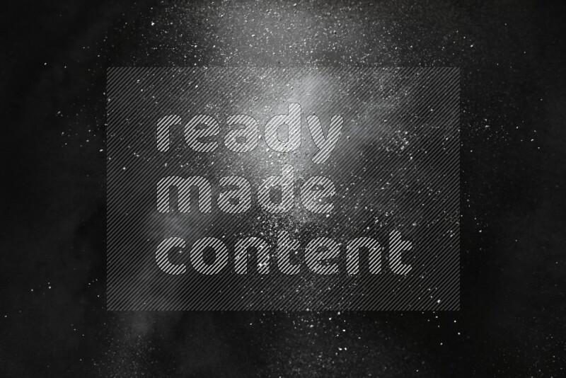 White powder explosion on black background
