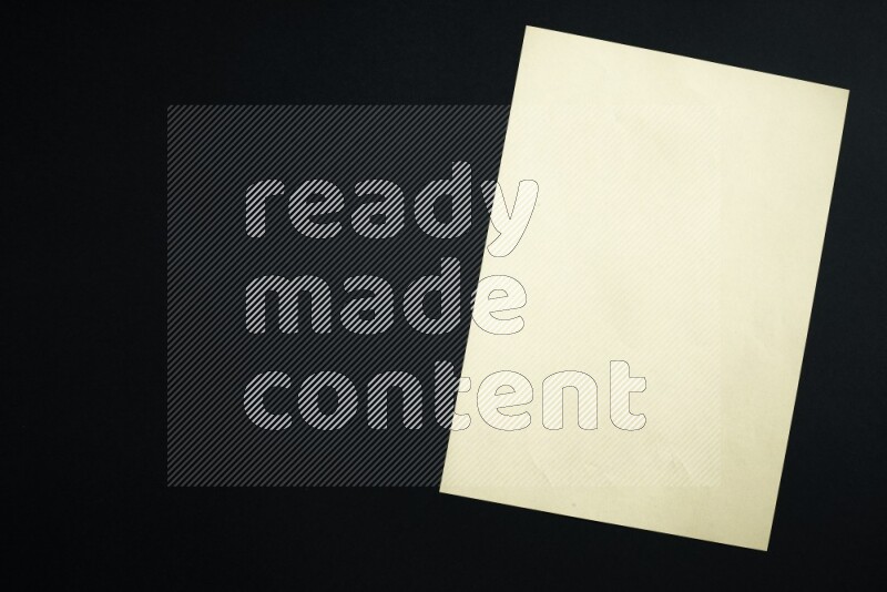 Multicolored paper sheet on black background